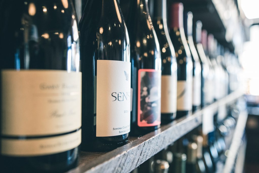 Organized wine bottles on a shelf